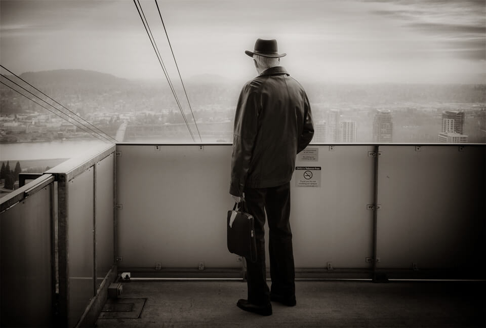 Man at top of tram